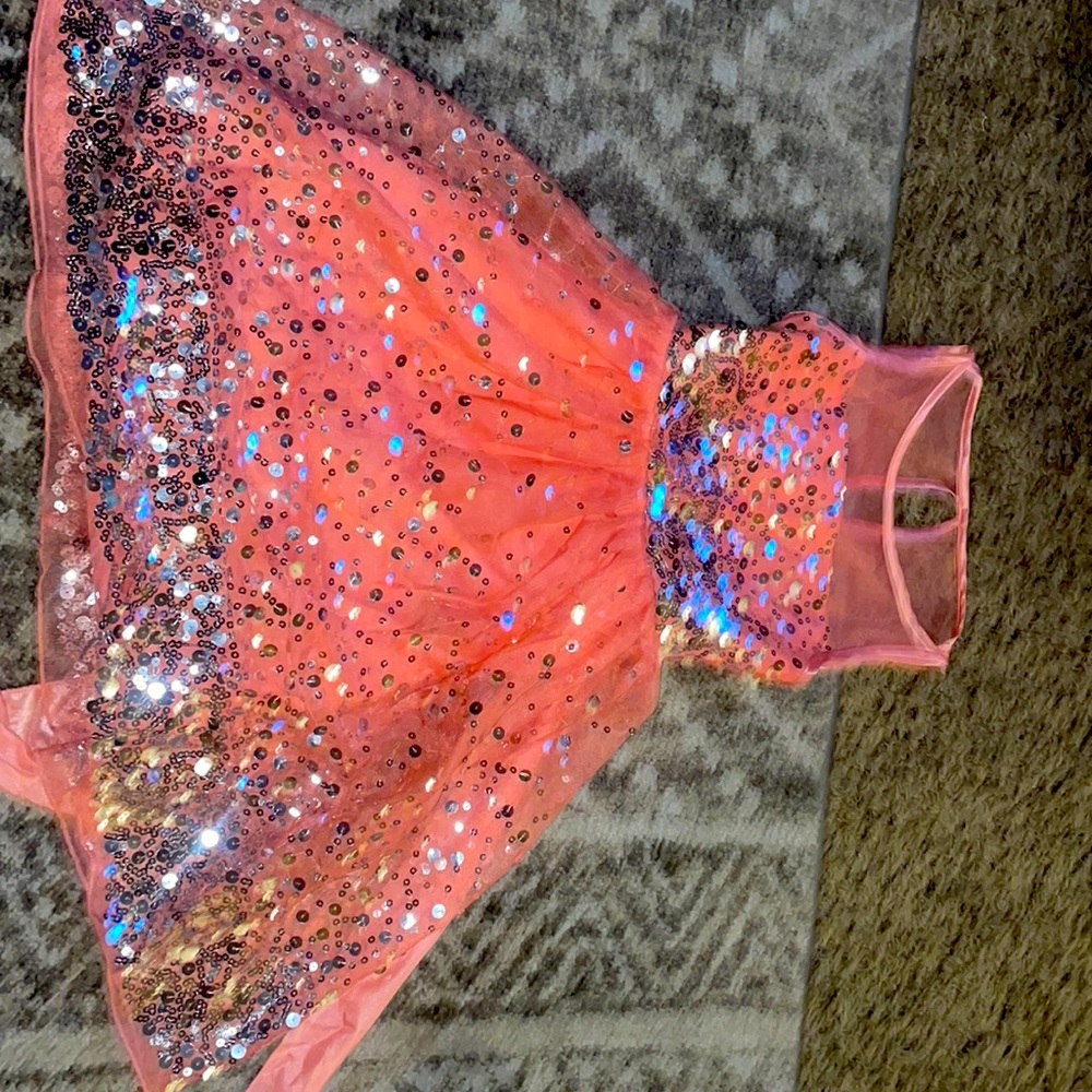 Pink sparkle dress with bow on the back and zipper to include.